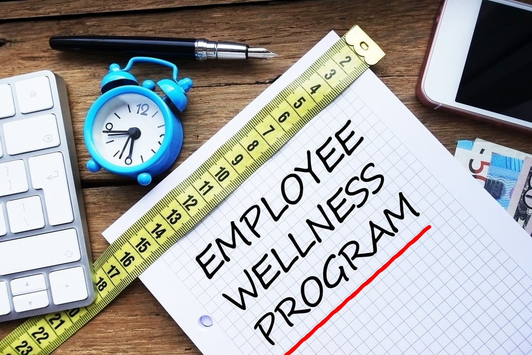 Employee wellness program written on personal agenda at the office