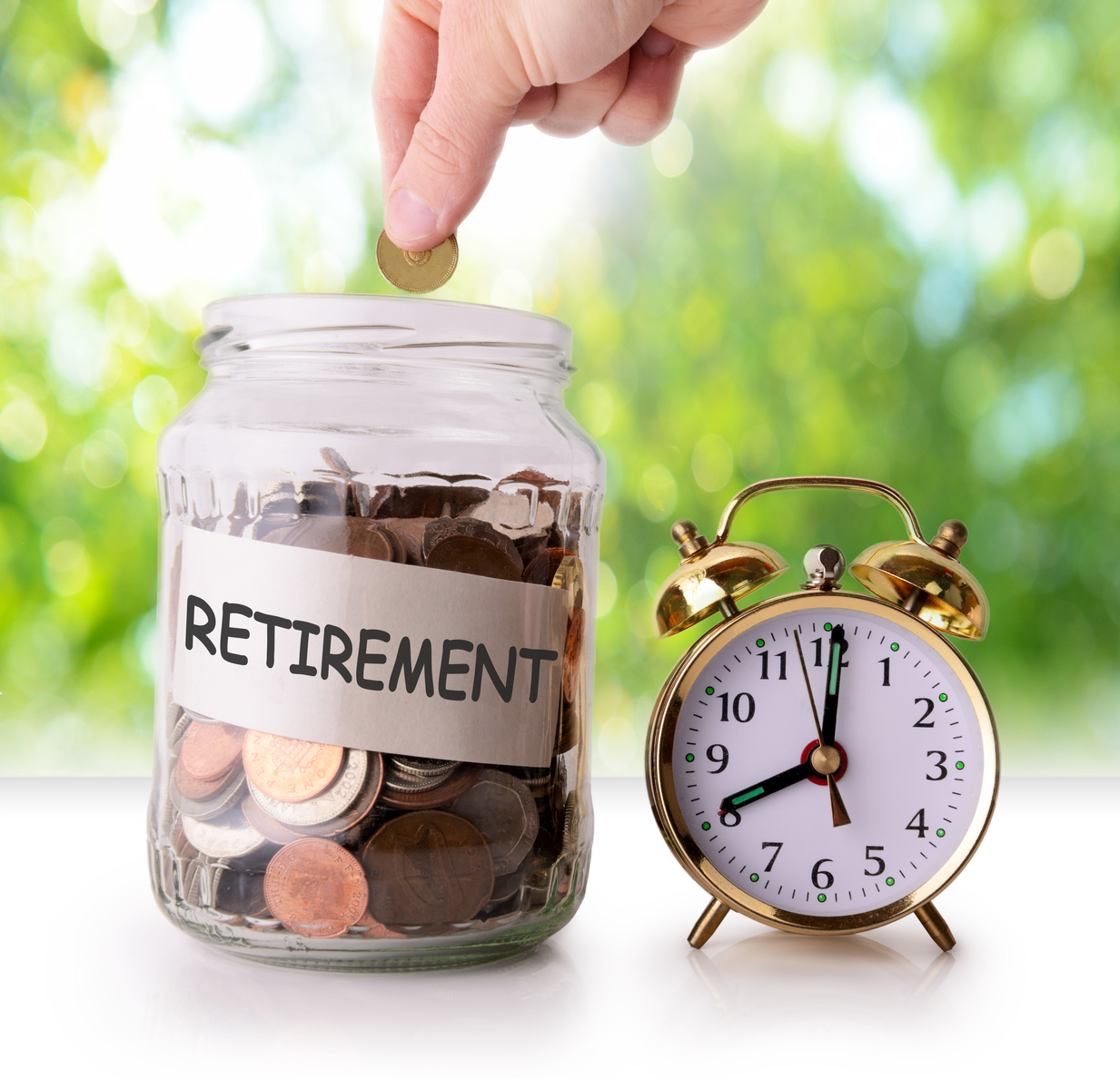 Coins in glass jar for retirement